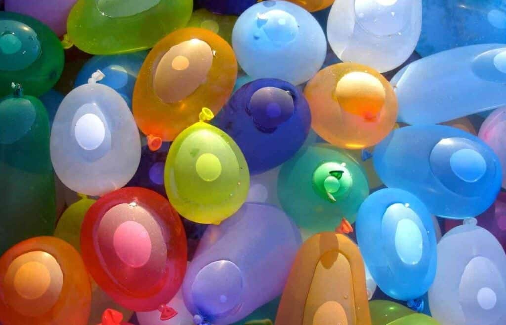 Close-up of colorful water balloons, perfect for fun outdoor water balloon games at a summer birthday party.
