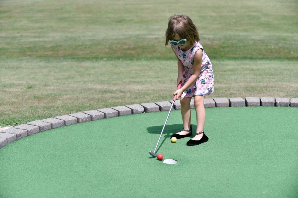 child at Mulligan's mini golf Caledonia Racine Wisconsin