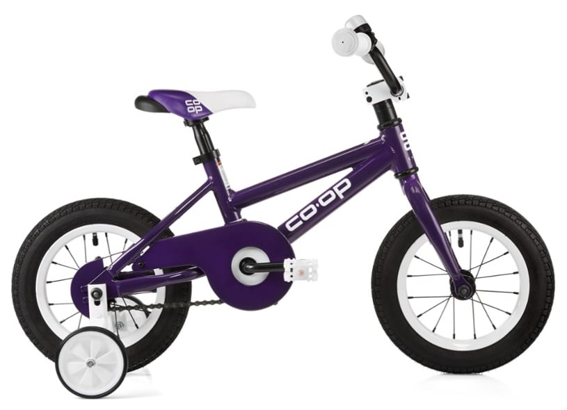 Purple Co-Op bike for kids with black wheels, training wheels, and white pedals and handlebars.