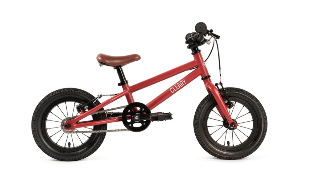 Red Cleary bike for kids with brown leather seat and no training wheels