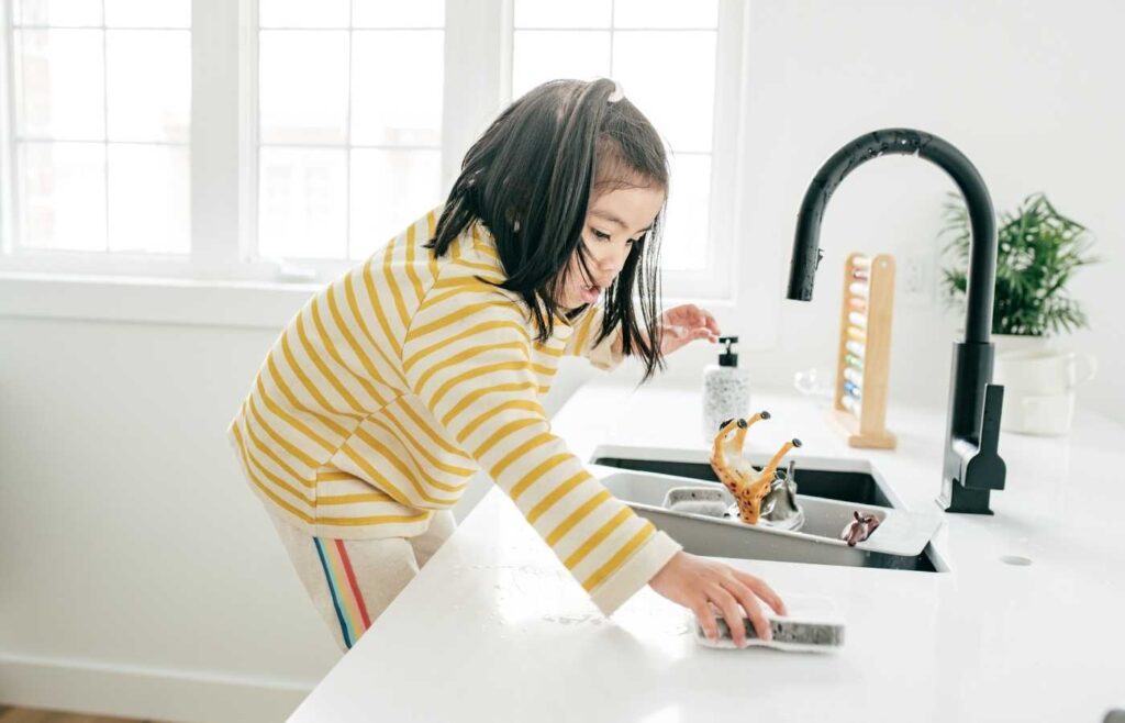 Child doing chores.