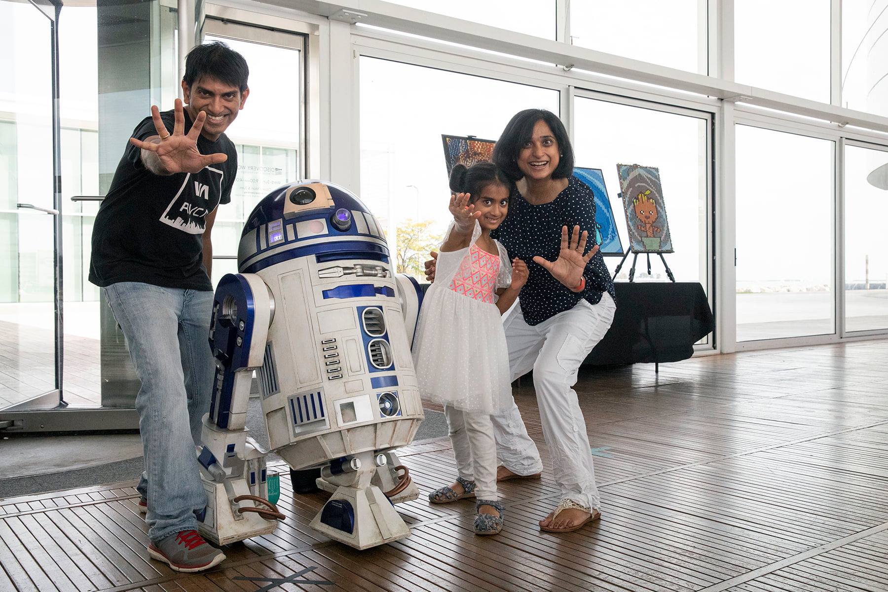 family with R2D2 for Sci-Fi Family Day at Discovery World Museum Milwaukee Wisconsin