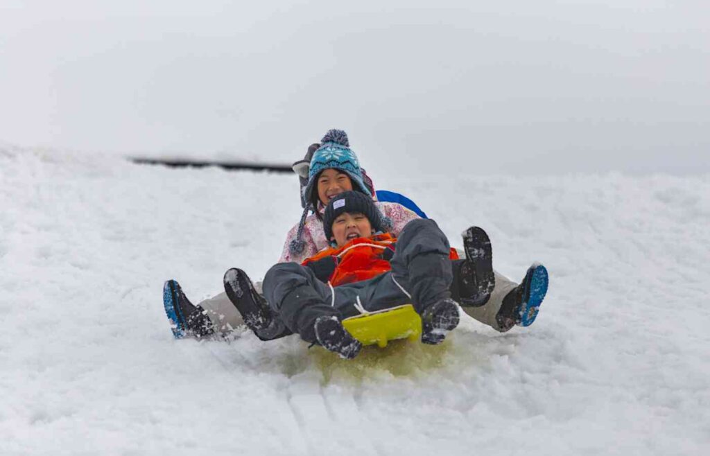 Sledding in the snow