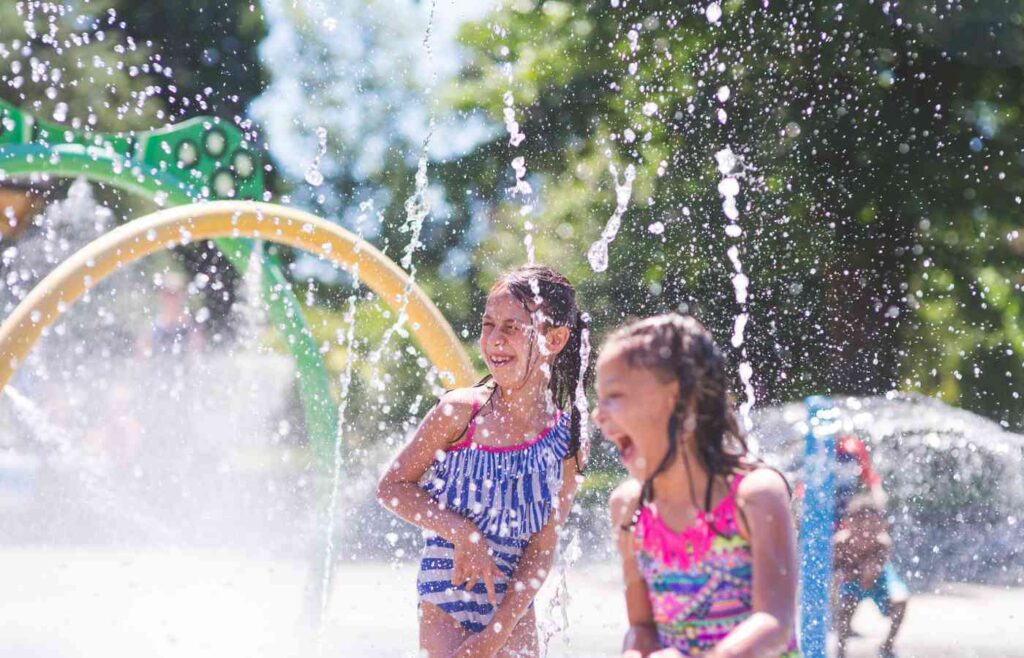 kids playing at a splash pad