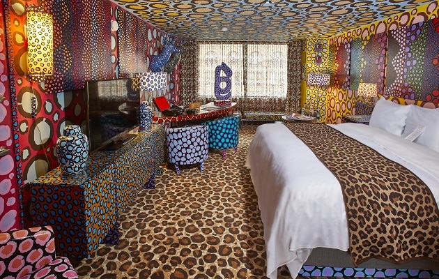 Artistic hotel room at St Kate's in downtown Milwaukee with wild animal prints on floors and walls and furniture.