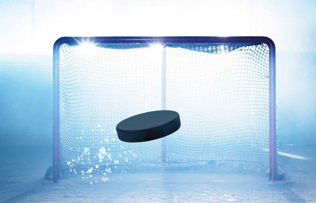 puck flying into goal