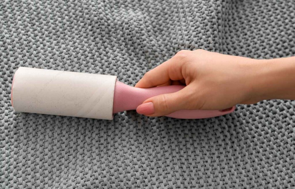 Lint roller being used on a blanket