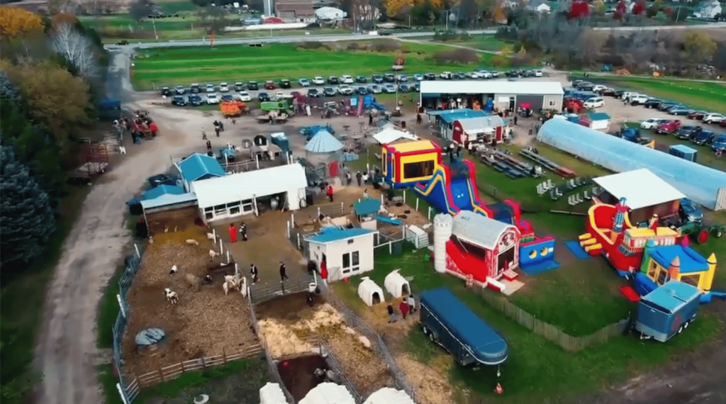 Aerial View of Cedarburg Creek Farm with large bouncy houses and farm animals.