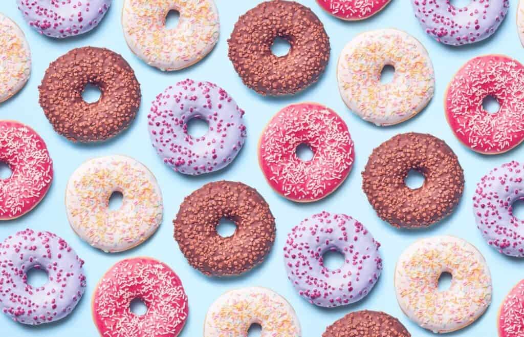 Assorted colorful donuts with sprinkles, perfect for a donut-making birthday party for kids